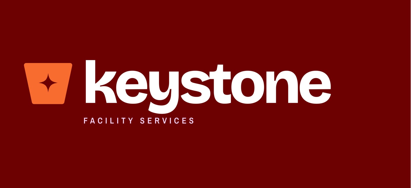 The new Keystone Facility Services logo: an orange keystone wedge with a sparkle, beside a lowercase wordmark on oxblood