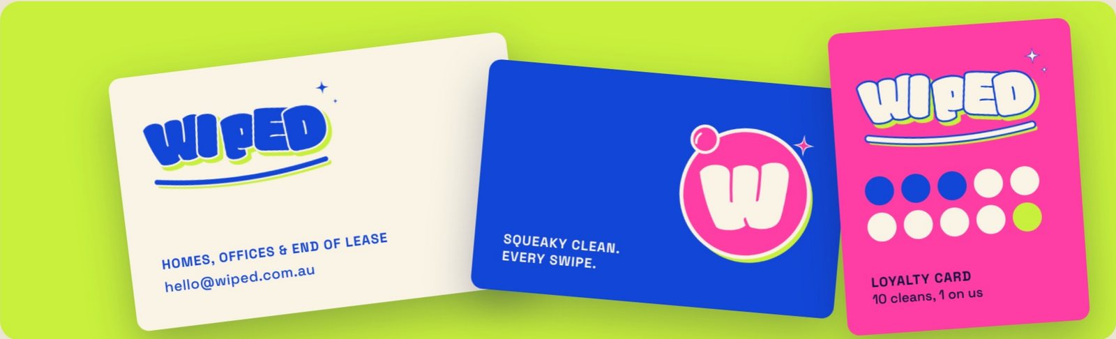 Wiped stationery: cream and cobalt business cards and a pink loyalty card
